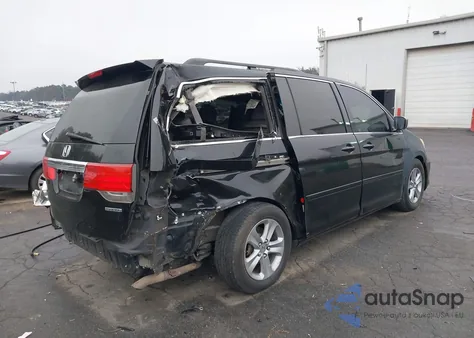 2010 Honda Odyssey Touring z USA, uszkodzony, nr VIN 5FNRL3H96AB049919